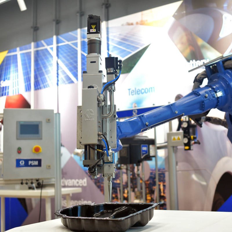 Graco Precision Shot Metering System Integrated with a Robot with Blue Arm