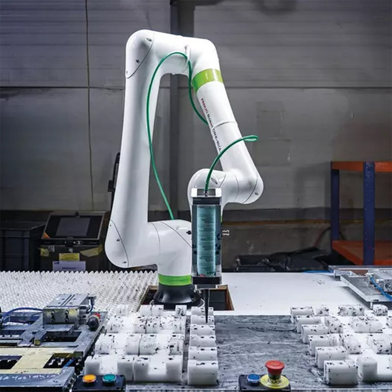 Robot arm dispensing green single-part fluid material